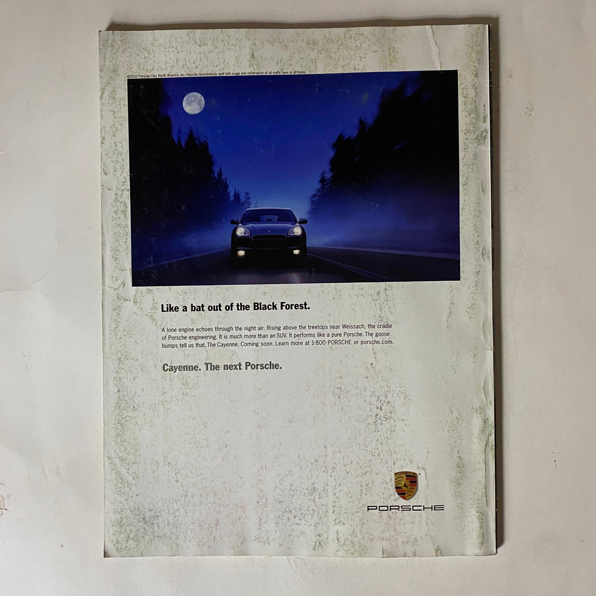 Back cover of Tennis Magazine July August 2002 featuring an advertisement for Porsche cars, emphasizing luxury and sophistication.