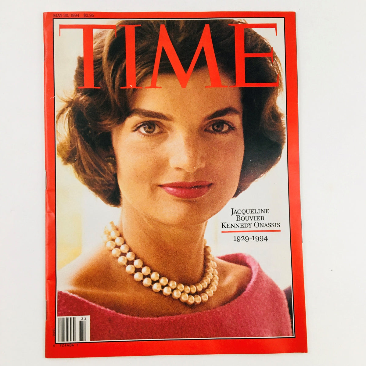 Time Magazine cover from May 30, 1994, featuring Jacqueline Bouvier Kennedy Onassis, showcasing her portrait with pearls and a pink blouse, commemorating her life from 1929 to 1994.