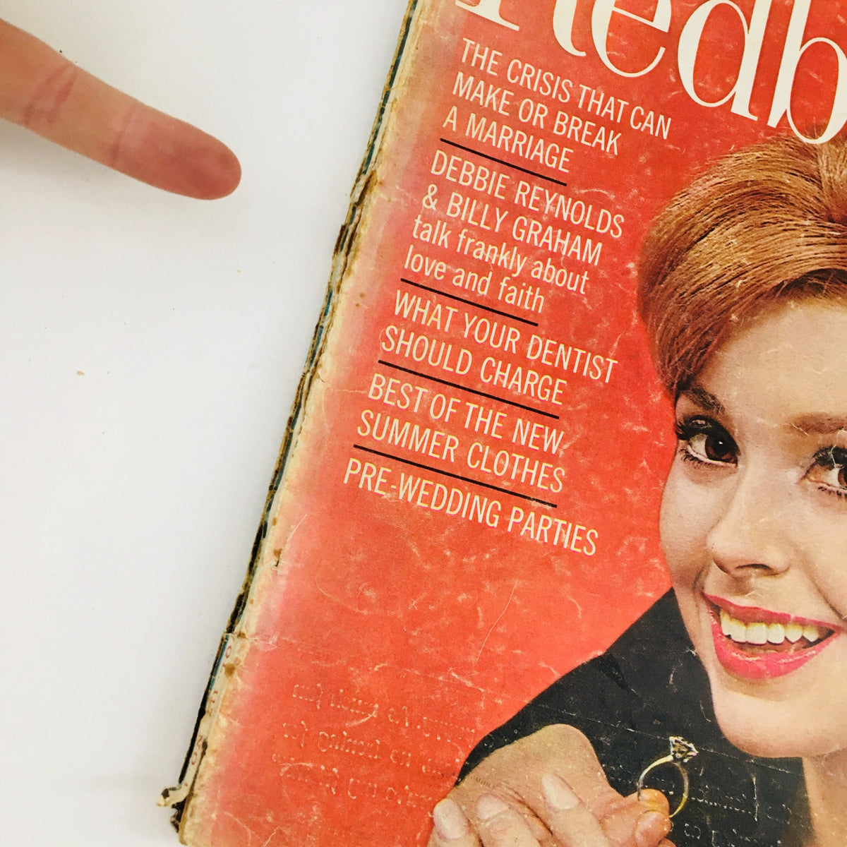 Cover of Redbook Magazine May 1961 featuring an article about love with Debbie Reynolds and Billy Graham. The vintage magazine shows signs of wear but highlights significant cultural themes.
