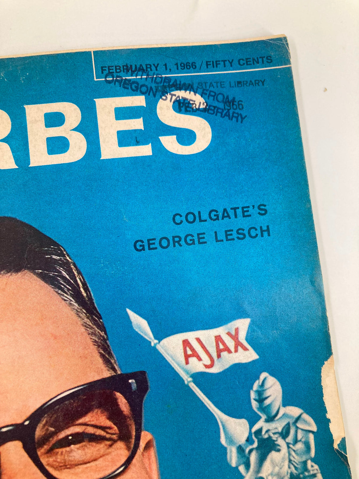 Close-up of the cover of VTG Forbes Magazine February 1 1966, highlighting a library stamp and details about Colgate's George Lesch.