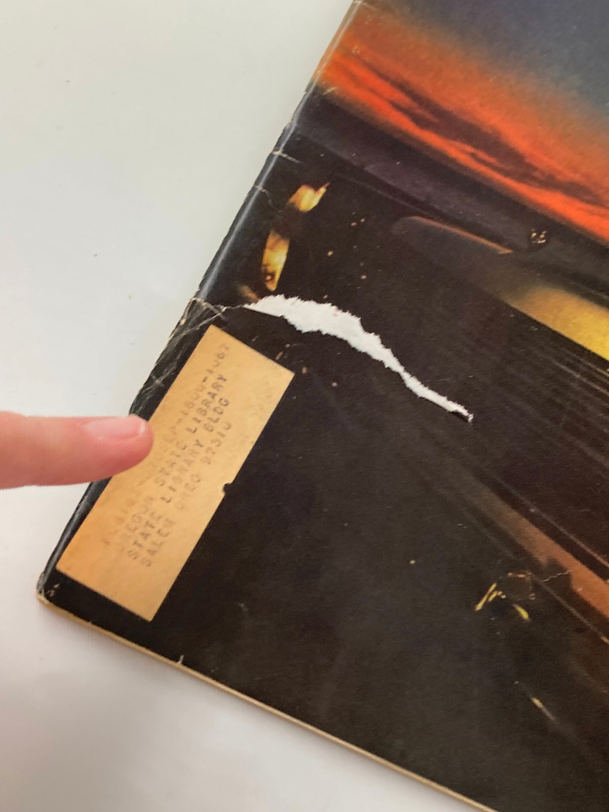 Close-up of the edge of VTG Forbes Magazine, December 1, 1966, highlighting the vintage label and wear on the cover.