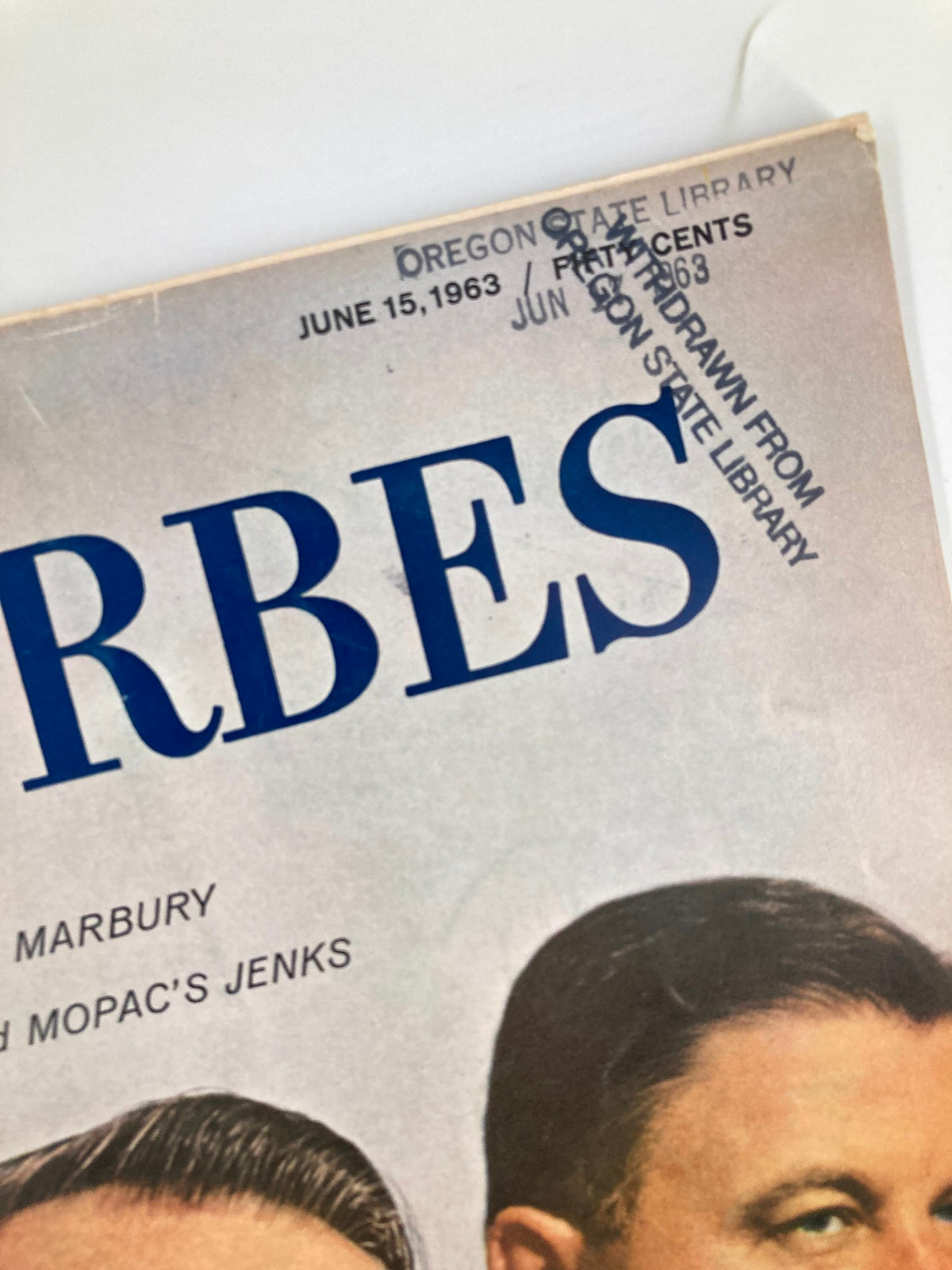 Close-up of the cover of VTG Forbes Magazine June 15 1963, showing the date and library stamp, emphasizing its vintage nature and historical significance.