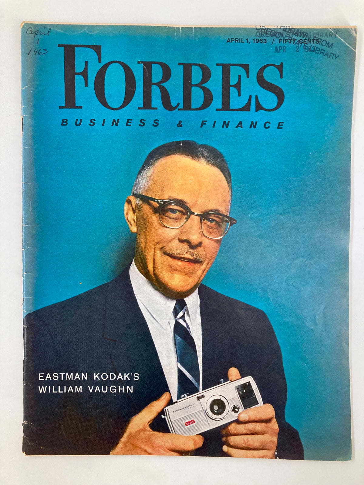 VTG Forbes Magazine April 1 1963 cover featuring Eastman Kodak's William Vaughn holding a camera, showcasing a vintage business and finance theme.