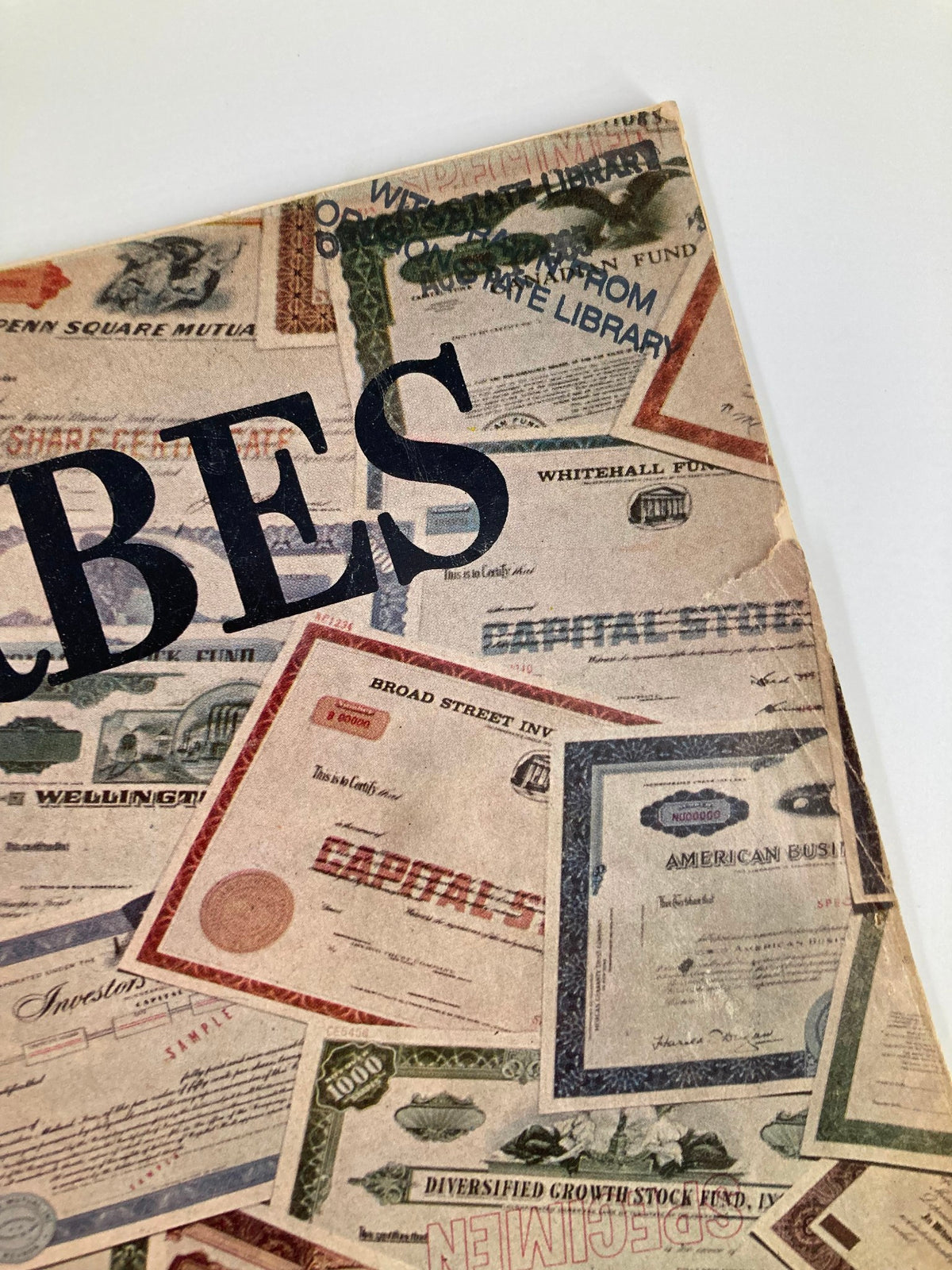 Detailed view of the VTG Forbes Magazine August 15 1965 cover highlighting the title Forbes and various investment certificates.