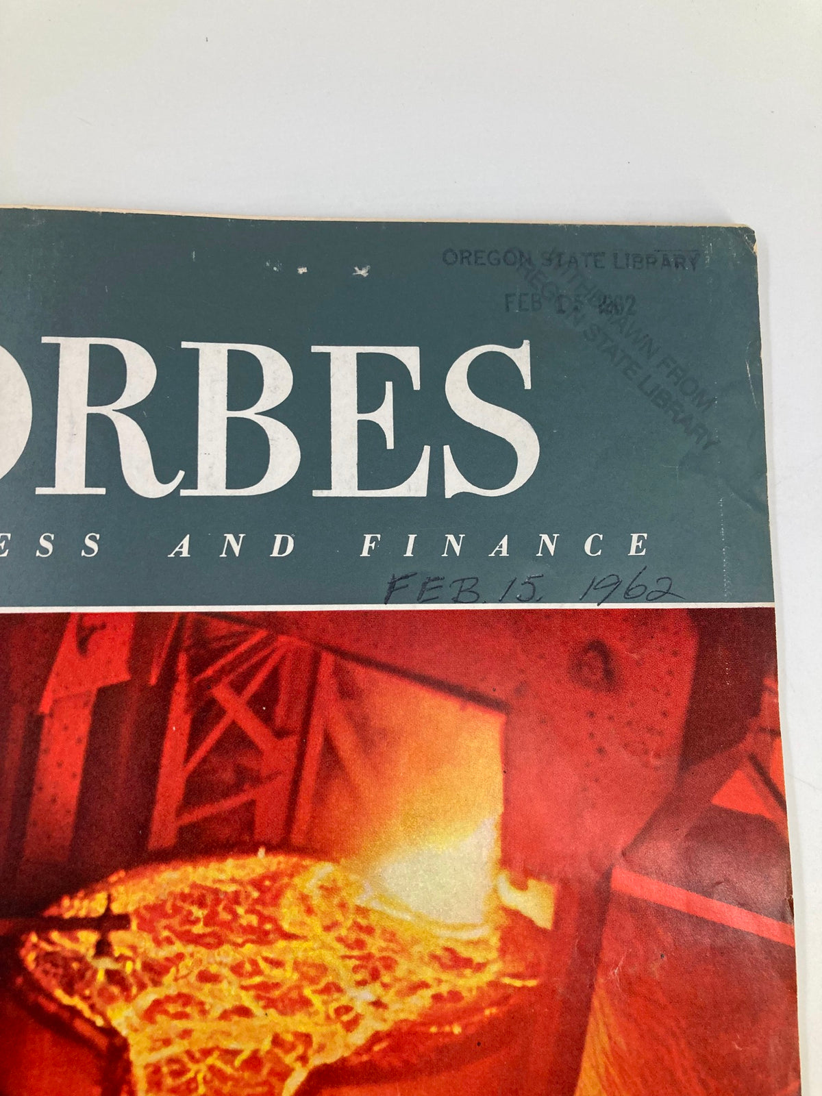 Close-up view of the cover of the VTG Forbes Magazine February 15, 1962, showing details of the title 'Steel Upturn: How Strong? How Long?' and library stamps.
