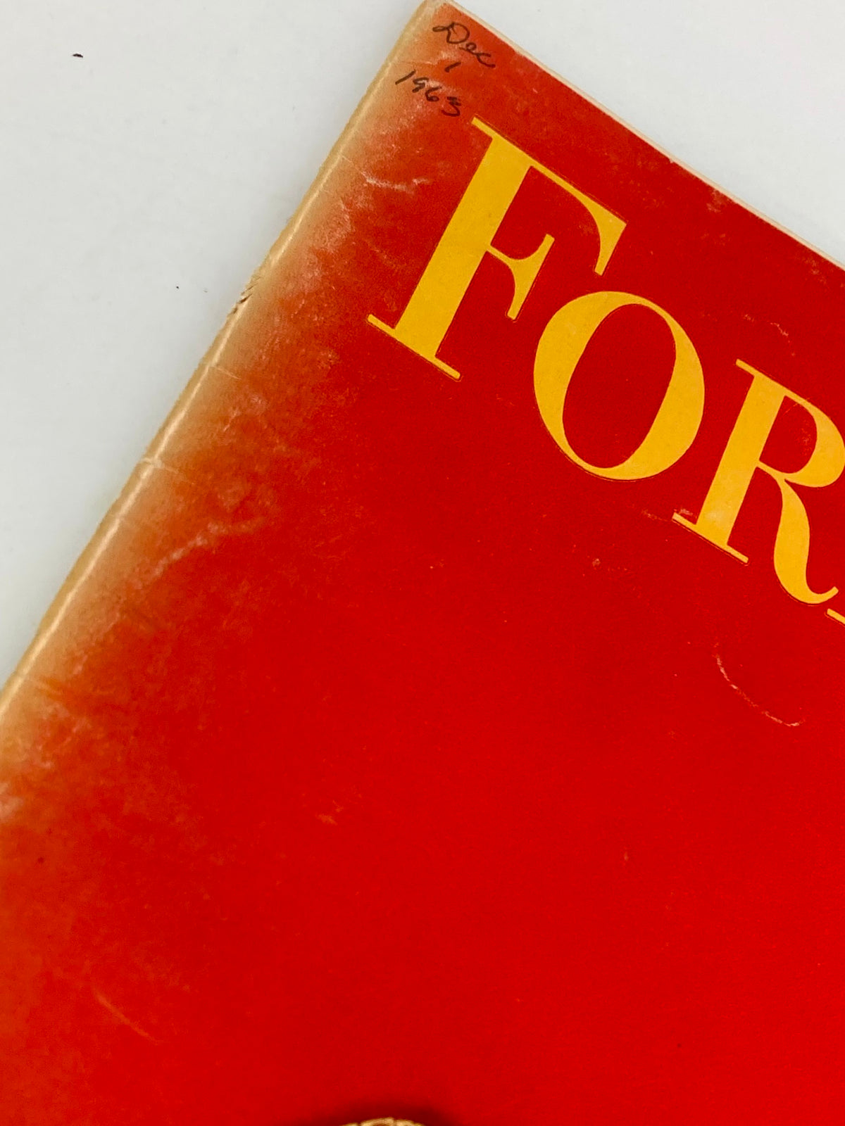 Side view of the cover of VTG Forbes Magazine December 1, 1963 showing wear and date markings, highlighting its vintage appeal.