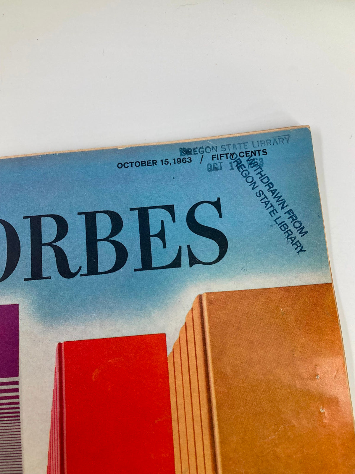 Close-up view of the header of VTG Forbes Magazine from October 15, 1963, showing the magazine title and date, with library stamp indicating it was withdrawn from Oregon State Library.