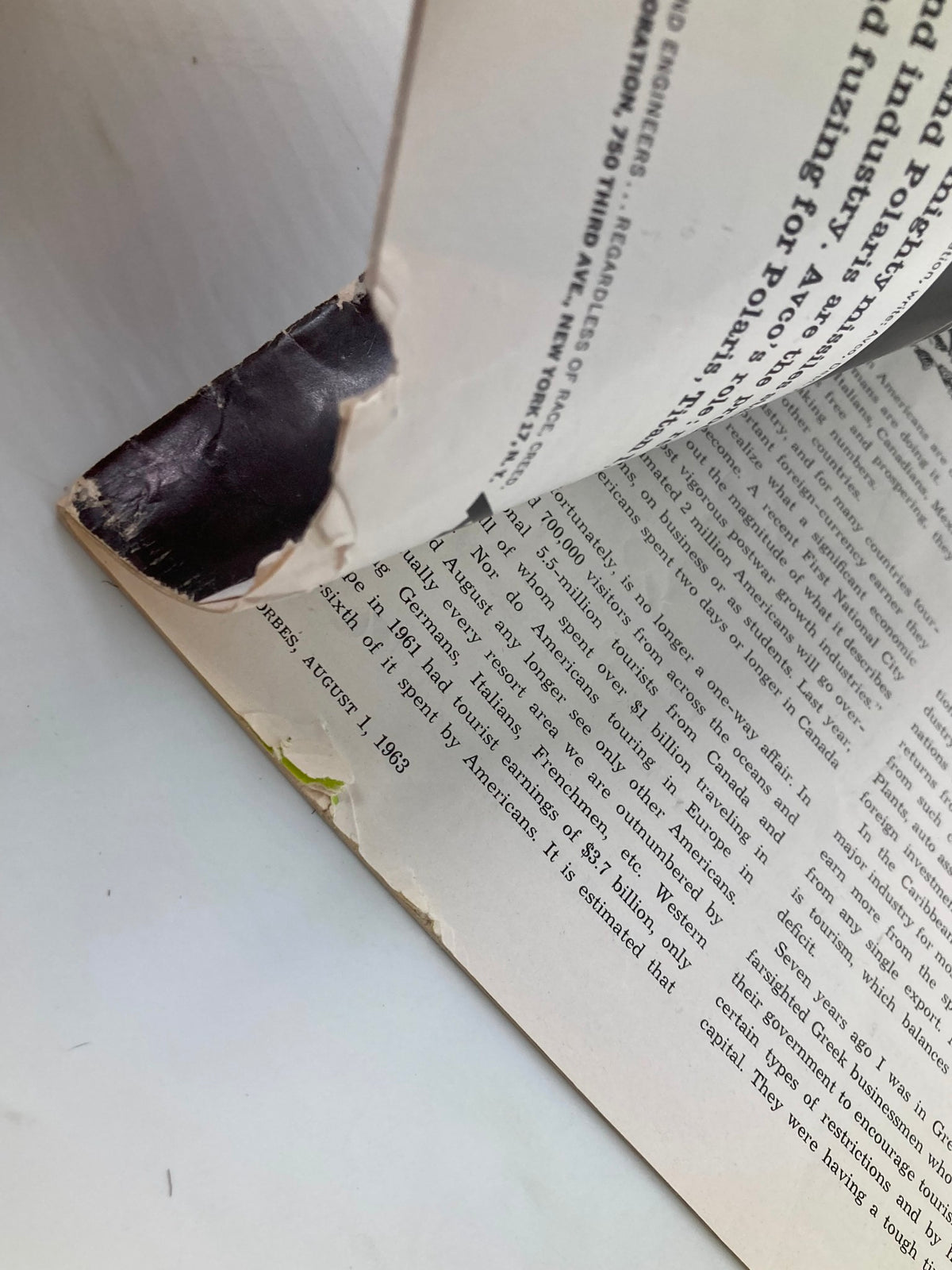 Close-up of the damaged corner of VTG Forbes Magazine October 1 1963, highlighting wear and tear on the binding.