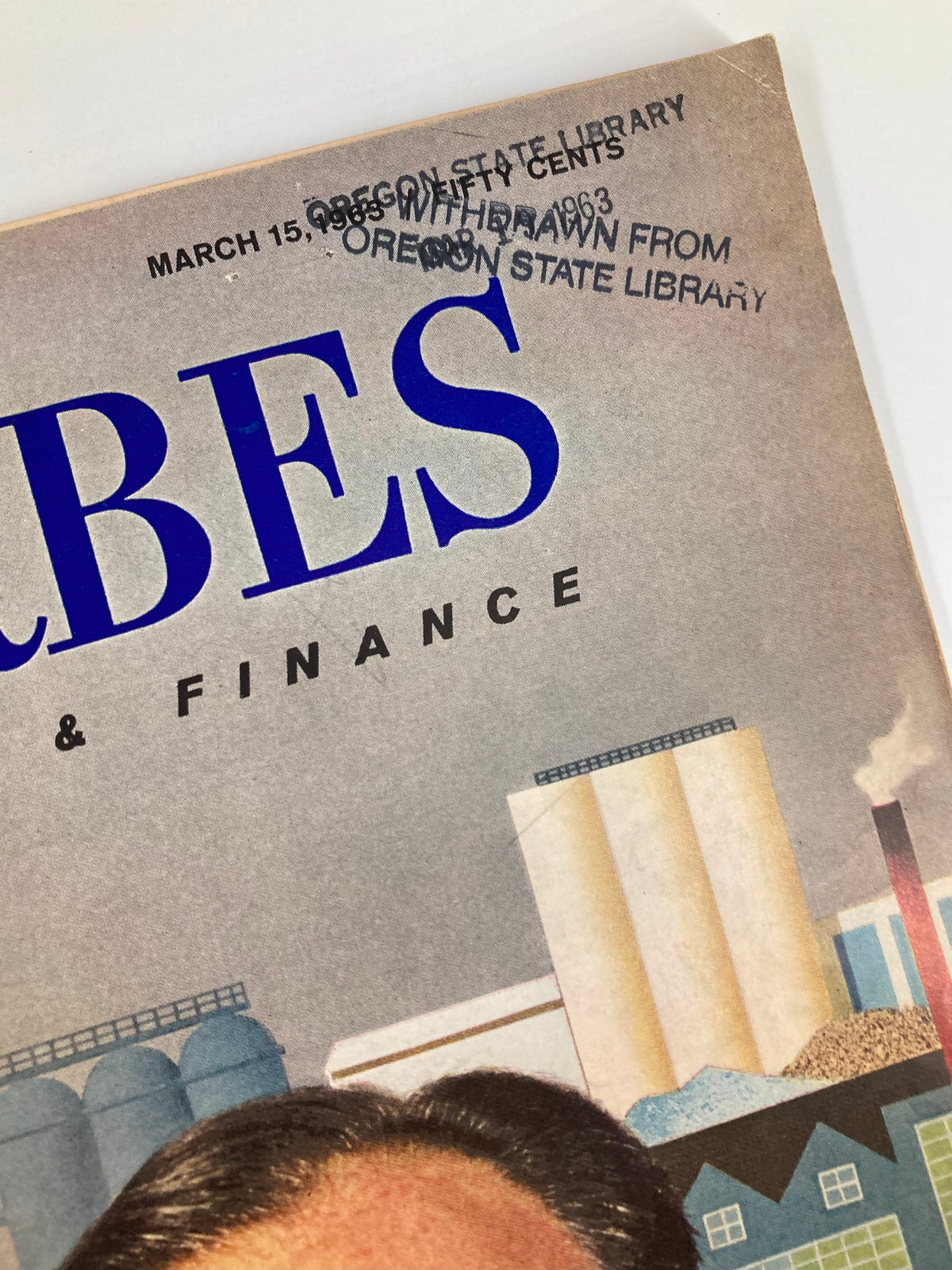Close-up of the cover of the Vintage Forbes Magazine from March 15, 1963, displaying the publication date and library withdrawn stamp, with Edgar Kaiser prominently featured.