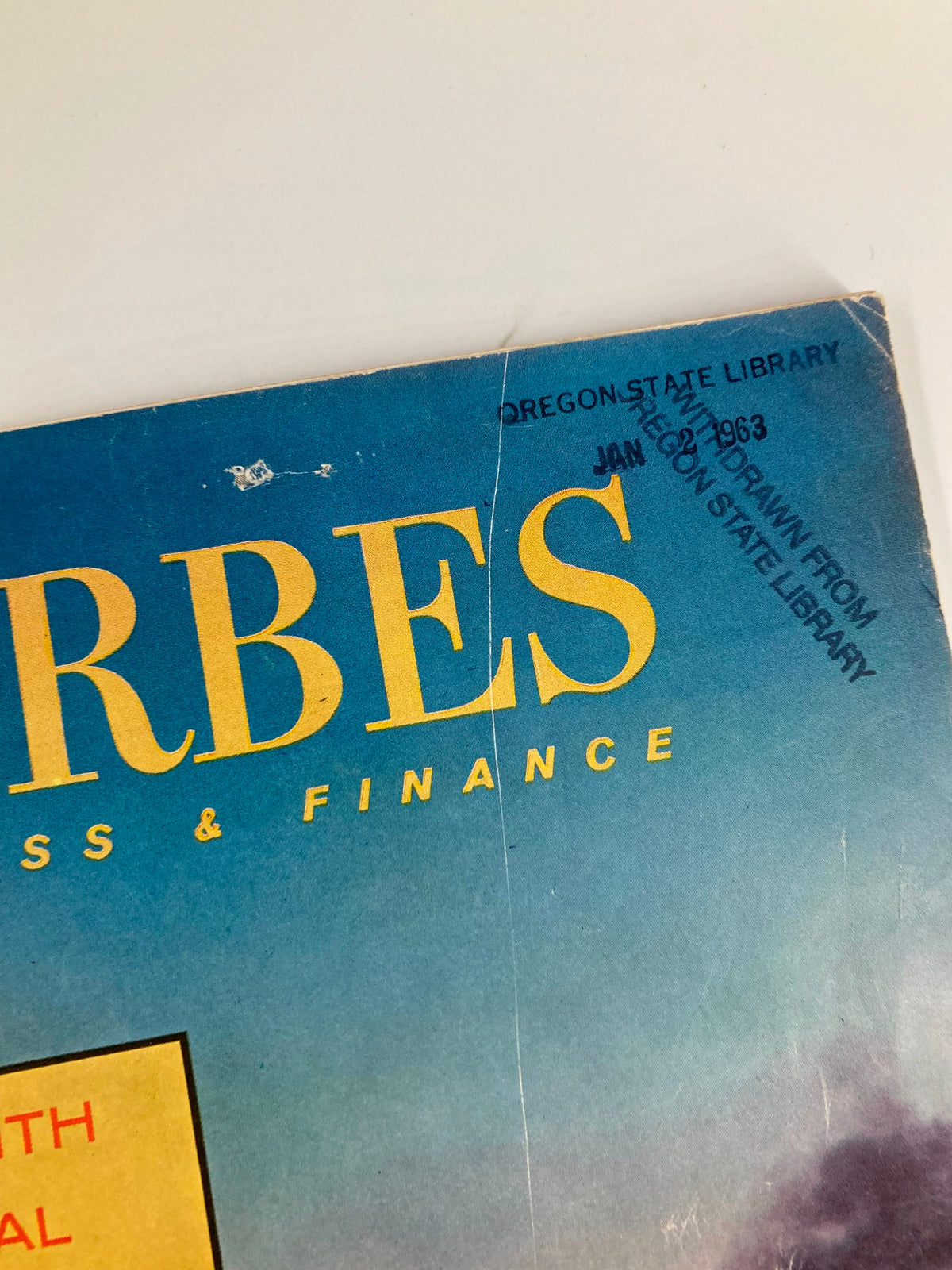 Close-up of the top section of VTG Forbes Magazine January 1, 1963, showing the publication label marked 'Withdrawn from Oregon State Library'.
