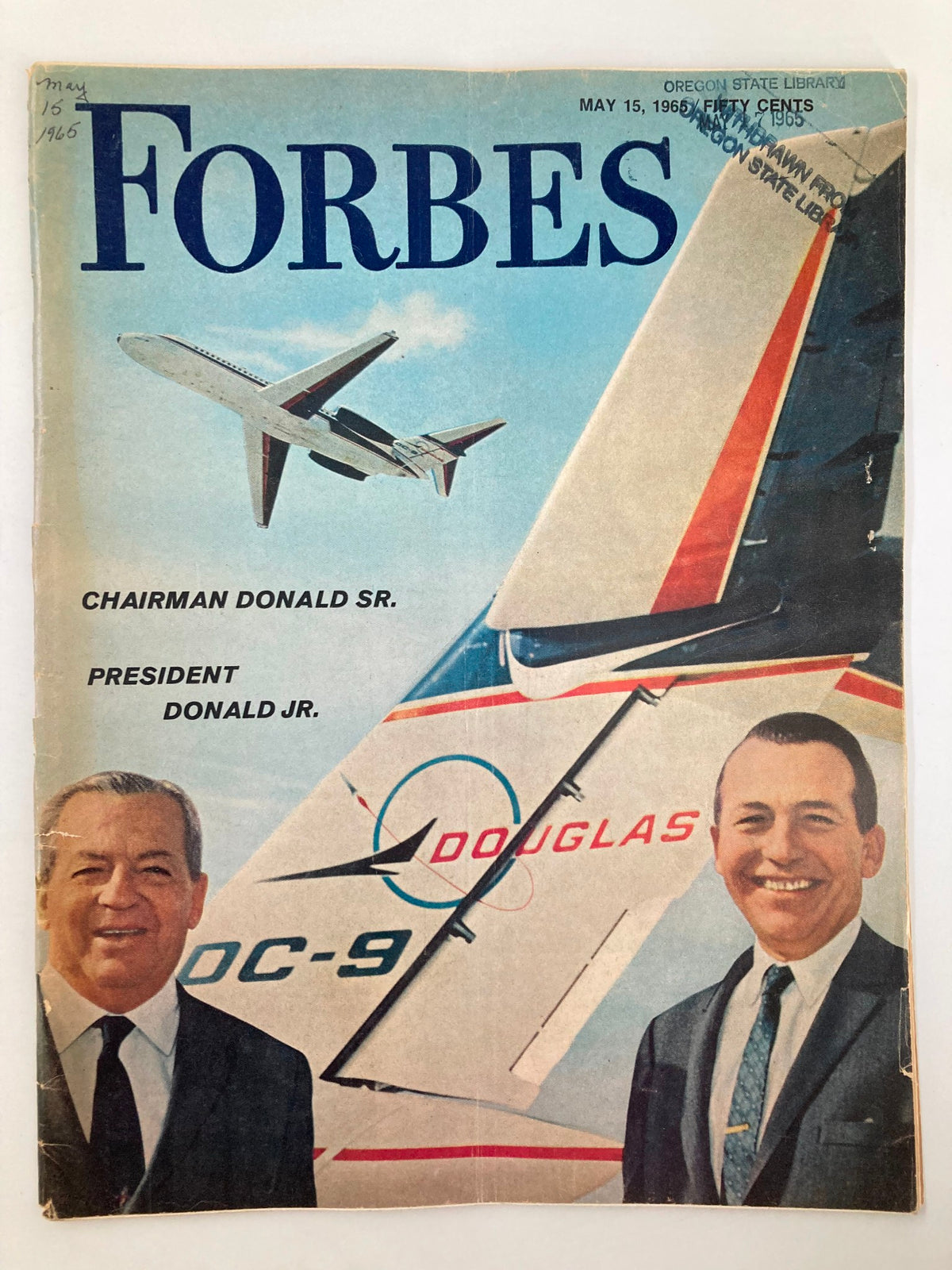 Cover of VTG Forbes Magazine May 15 1965 featuring Chairman Donald Sr. and President Donald Jr. with a Douglas DC-9 airplane in the background.