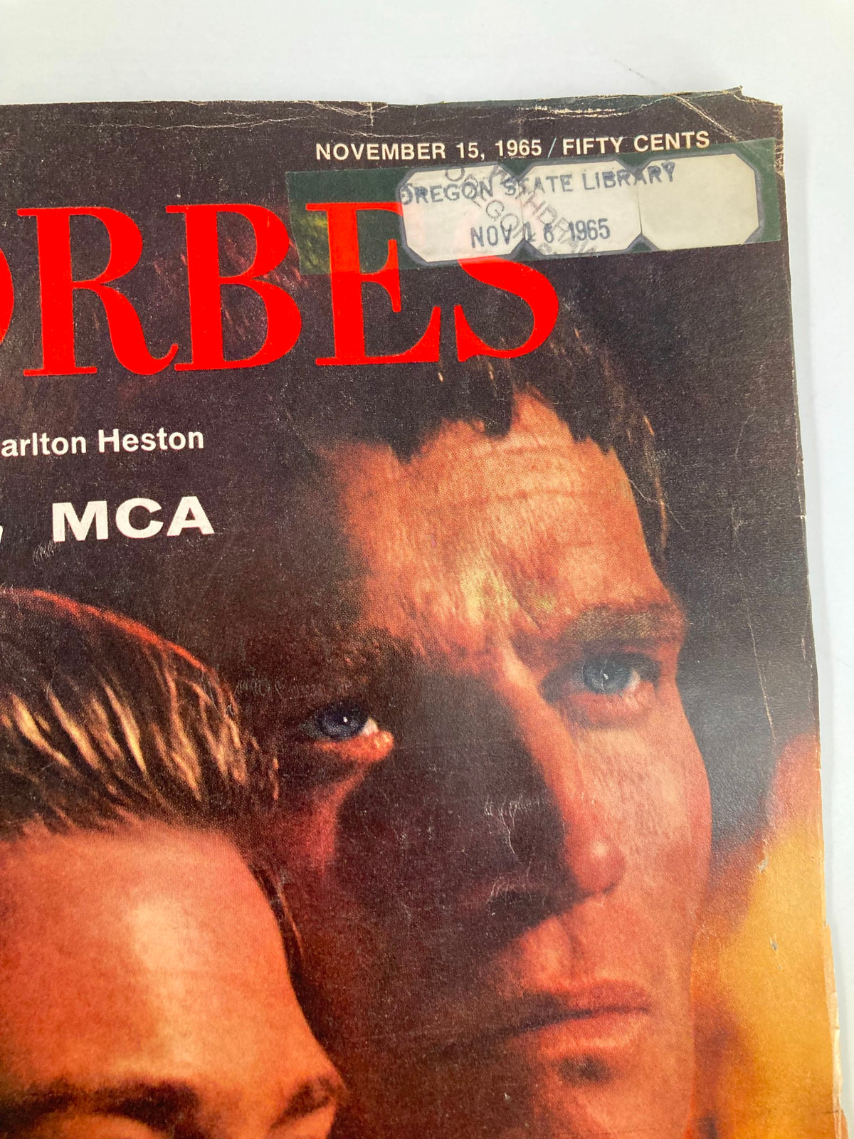 Close-up detail of the VTG Forbes Magazine cover dated November 15 1965 with Rosemary Forsyth and Charlton Heston, emphasizing vintage publication details.