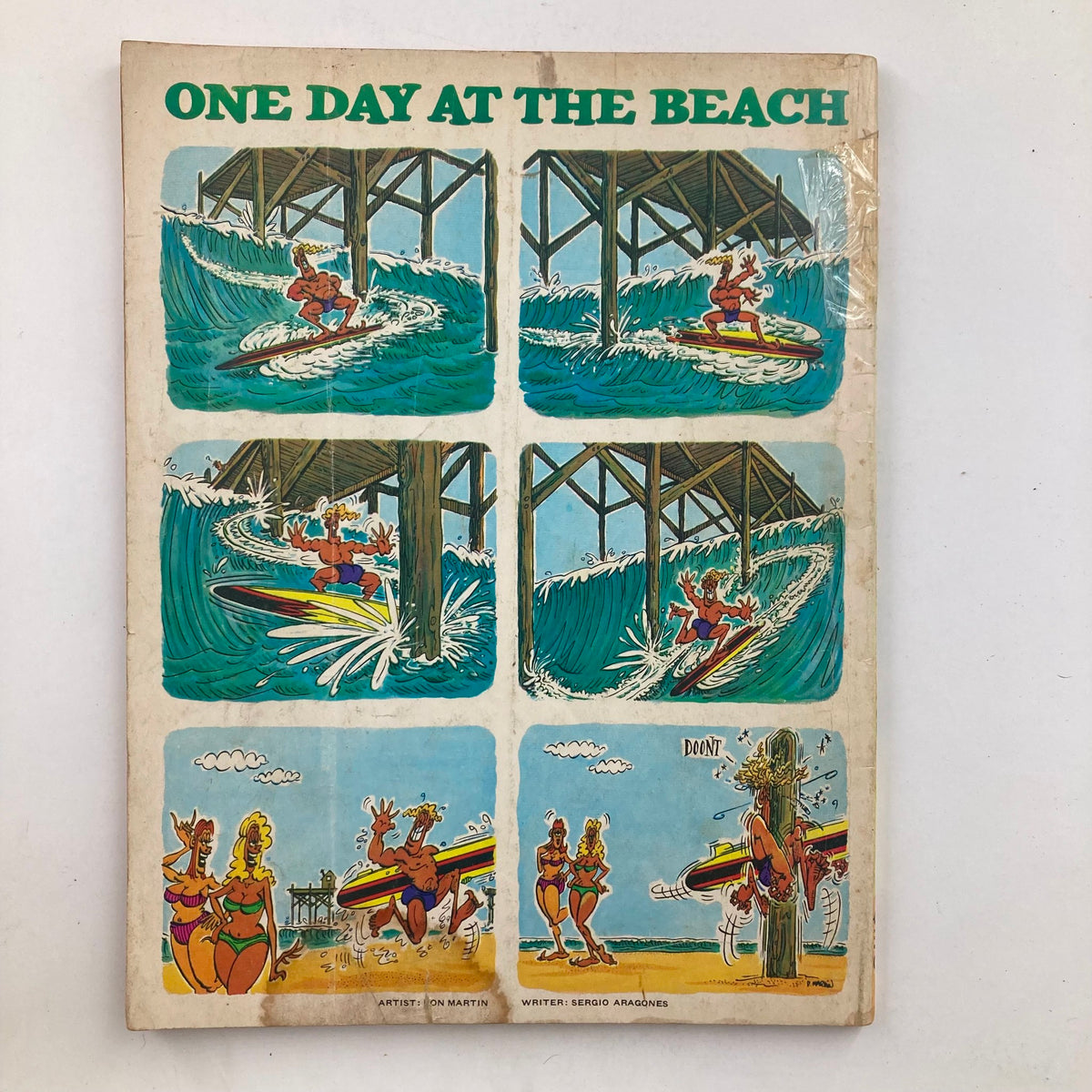 Back cover of Mad Super Special Spring 1982 No. 38, featuring a comic strip titled 'One Day at the Beach' with humorous surfing illustrations by Don Martin.