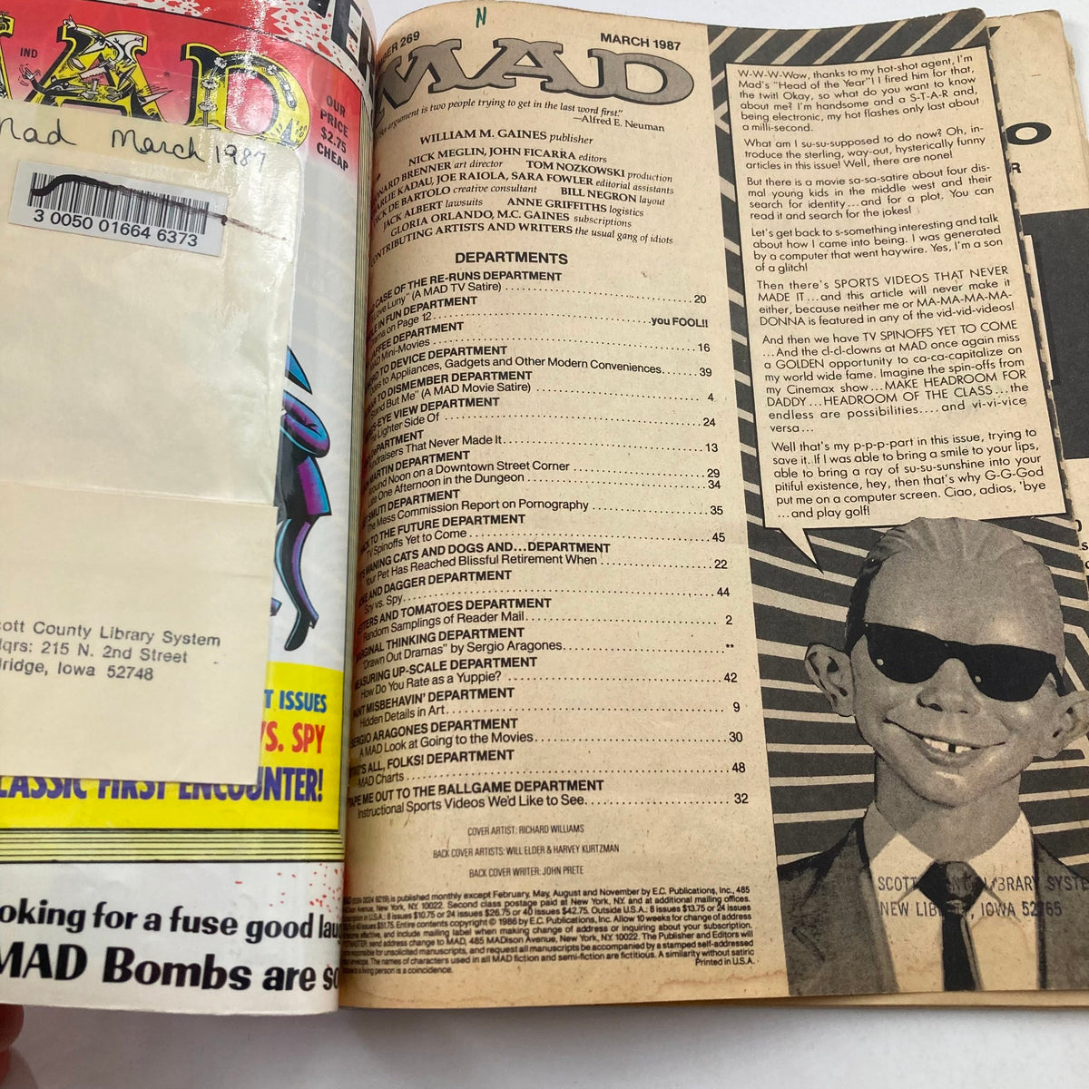 Interior page of Mad Magazine March 1987 No. 269 displaying the table of contents alongside the recognizable character Alfred E. Neuman. This page illustrates the magazine's satirical take on pop culture and various TV shows.