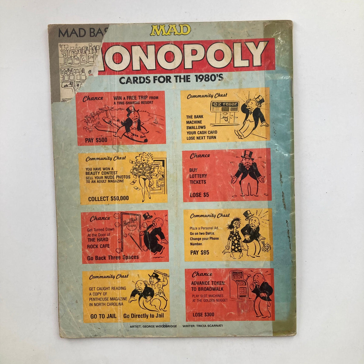 Back cover of Mad Magazine September 1987 No. 273 depicting Mad Monopoly cards for the 1980s, illustrating humorous game scenarios and parody.