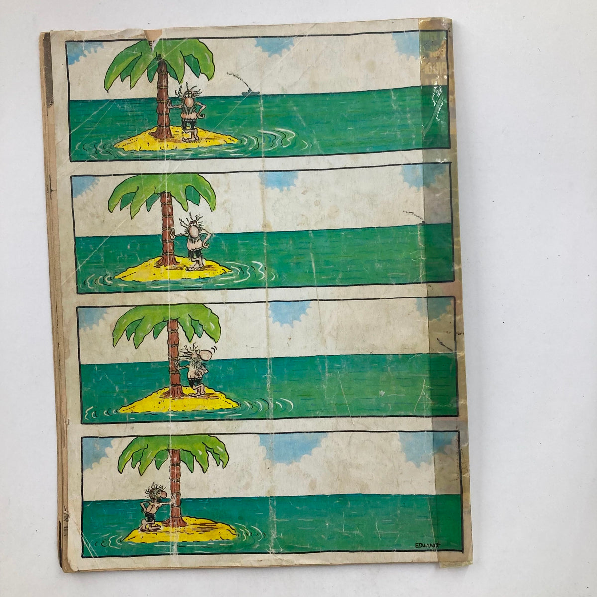 Back cover of Mad Magazine June 1985 No. 255 featuring a humorous comic strip with a character interacting with a palm tree on a deserted island.