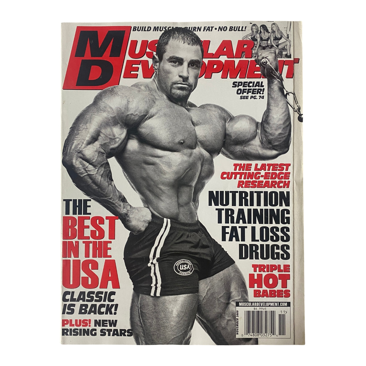 Muscular Development Magazine November 2009 featuring Mark Alvisi on the cover, showcasing bodybuilding techniques and fitness tips.
