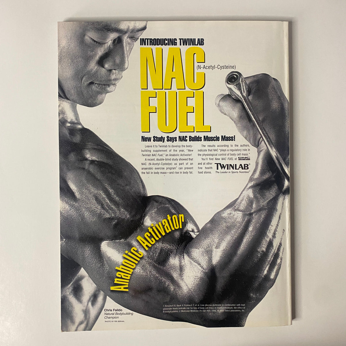 Image from Muscular Development Magazine July 1997, featuring an advertisement for NAC Fuel by Twinlab, showcasing a muscular man demonstrating strength. Includes the tagline about building muscle mass.