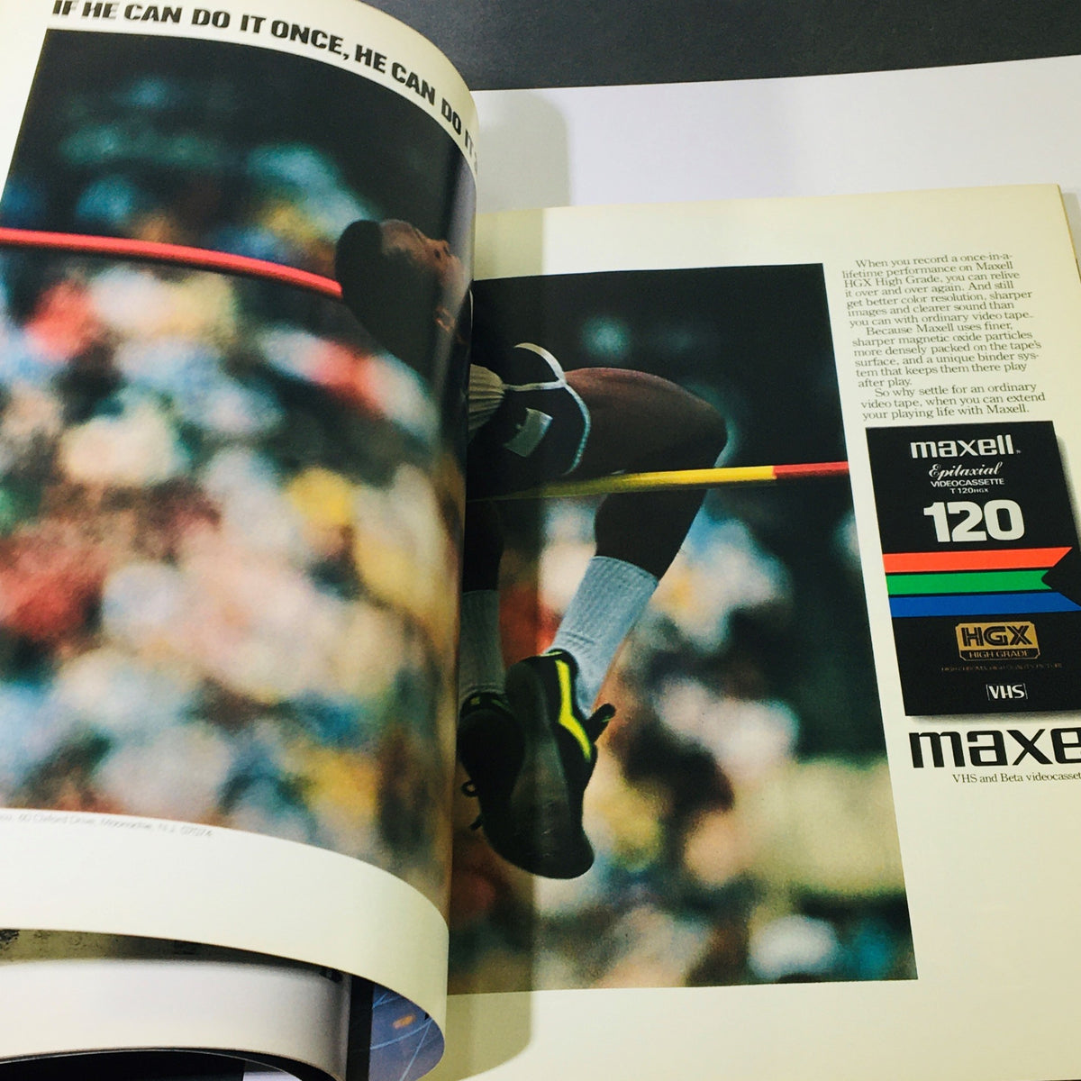Image from the Official Olympic Souvenir Program 1984 - Games of XXIIIrd Olympiad Los Angeles featuring a high jump athlete with a motivational quote, emphasizing determination in sports.