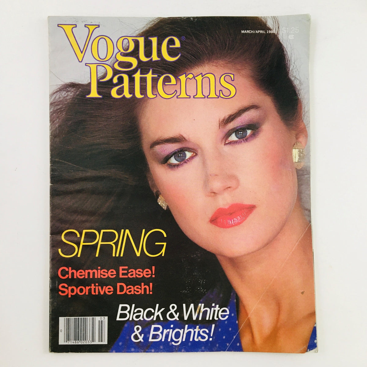 Vogue Patterns Magazine March 1980 cover featuring a model with striking makeup, highlighting the theme of spring fashion with bold colors and patterns.