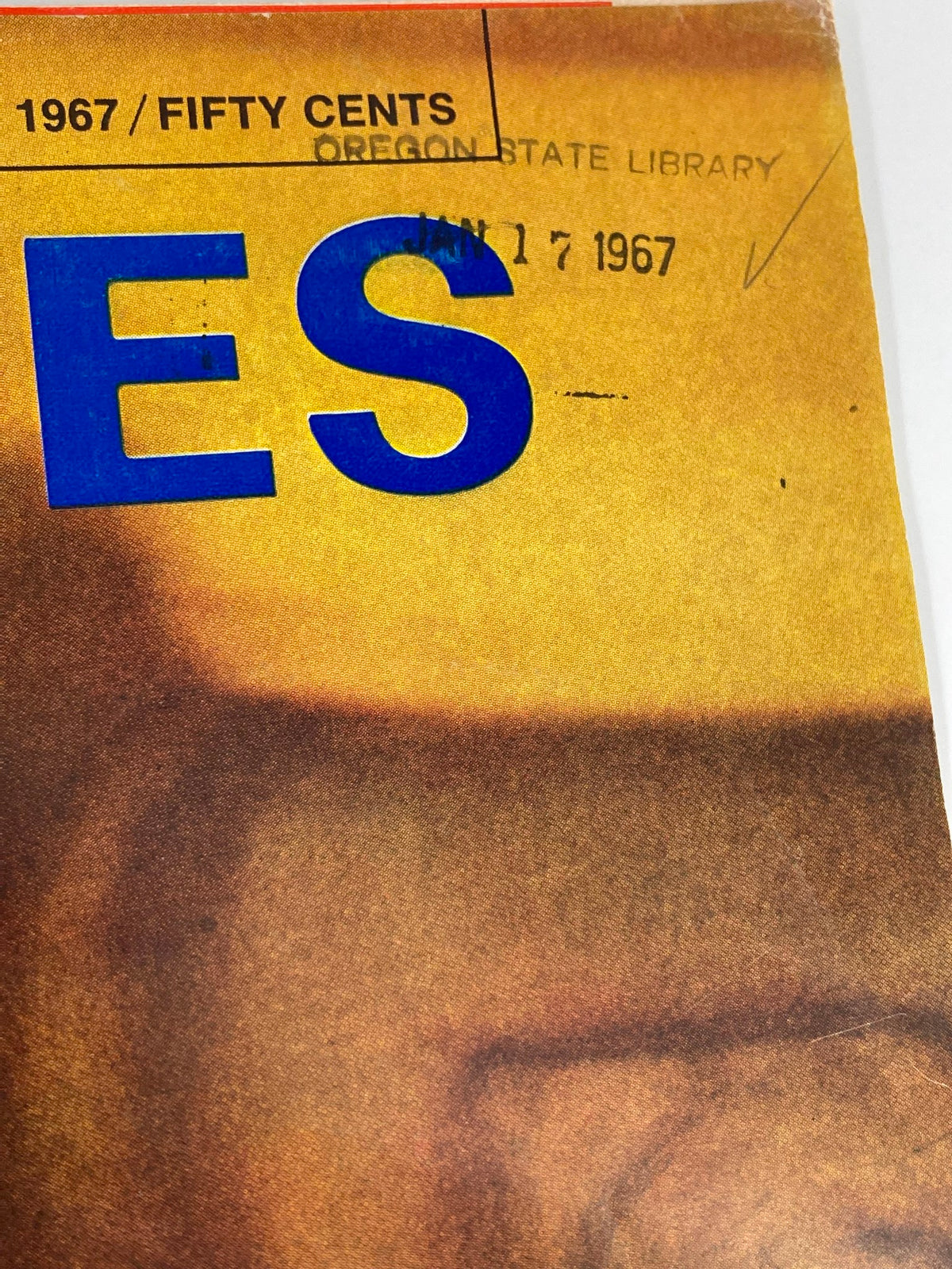 Close-up image of the vintage Forbes Magazine cover's date details, revealing '1967 / FIFTY CENTS' with a library stamp from Oregon State Library.