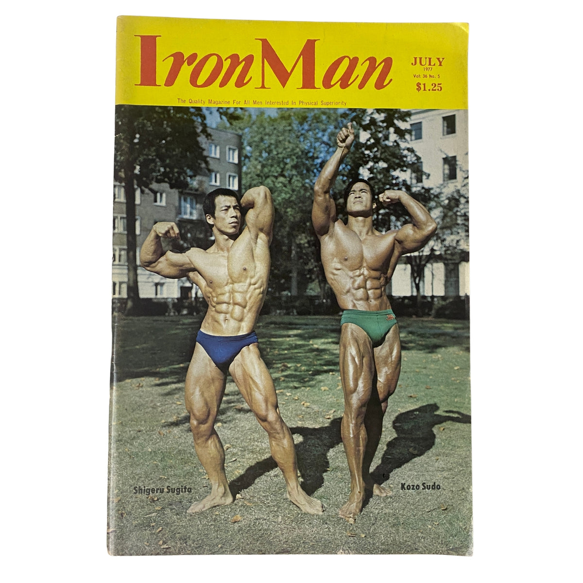 IronMan Magazine July 1977 featuring bodybuilders Shigeru Sugita and Kozo Sudo posing outdoors.