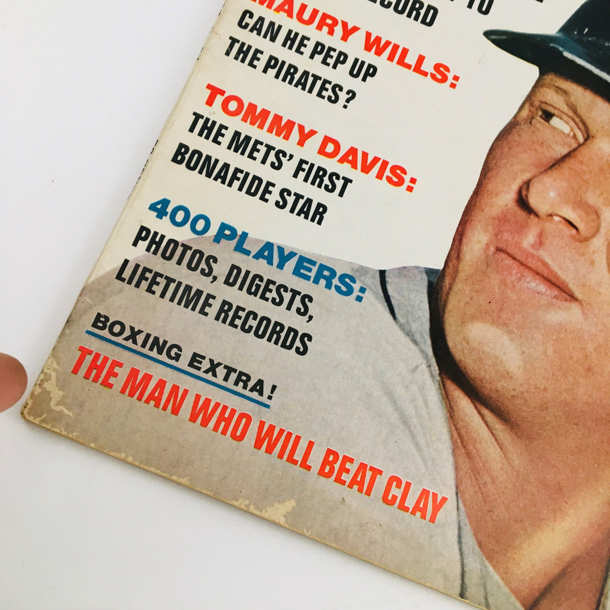Close-up view of the Dell Sports Magazine cover from July 1967, showcasing Boog Powell, Maury Wills, and Tommy Davis, with prominent text highlighting 'The Man Who Will Beat Clay'.