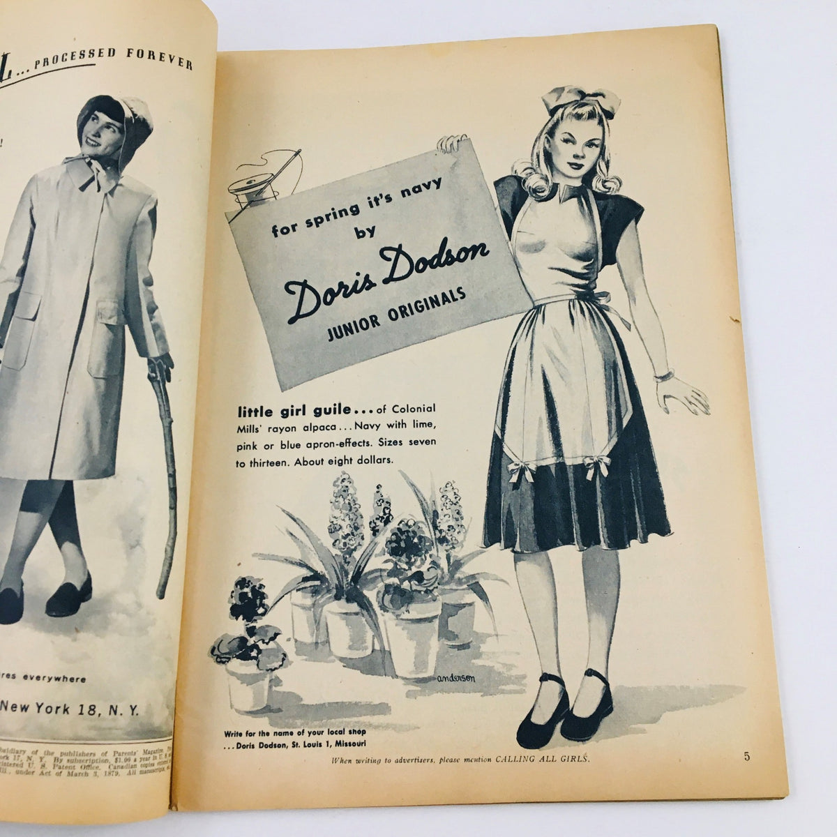 An advertisement from the interior of Calling All Girls Magazine March 1946 featuring a model showcasing a stylish dress by Doris Dodson, highlighting women’s fashion trends of the era.