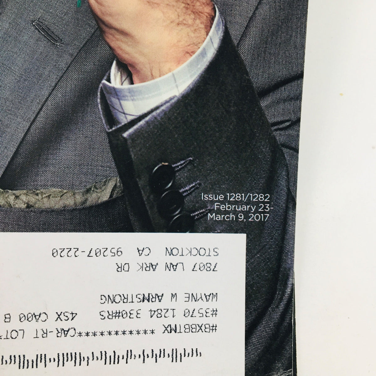 Close-up of Rolling Stone Magazine February 23 2017 cover showing John Oliver's hand gesture and suit details, part of the issue 'The Dudes vs The ISIS.'