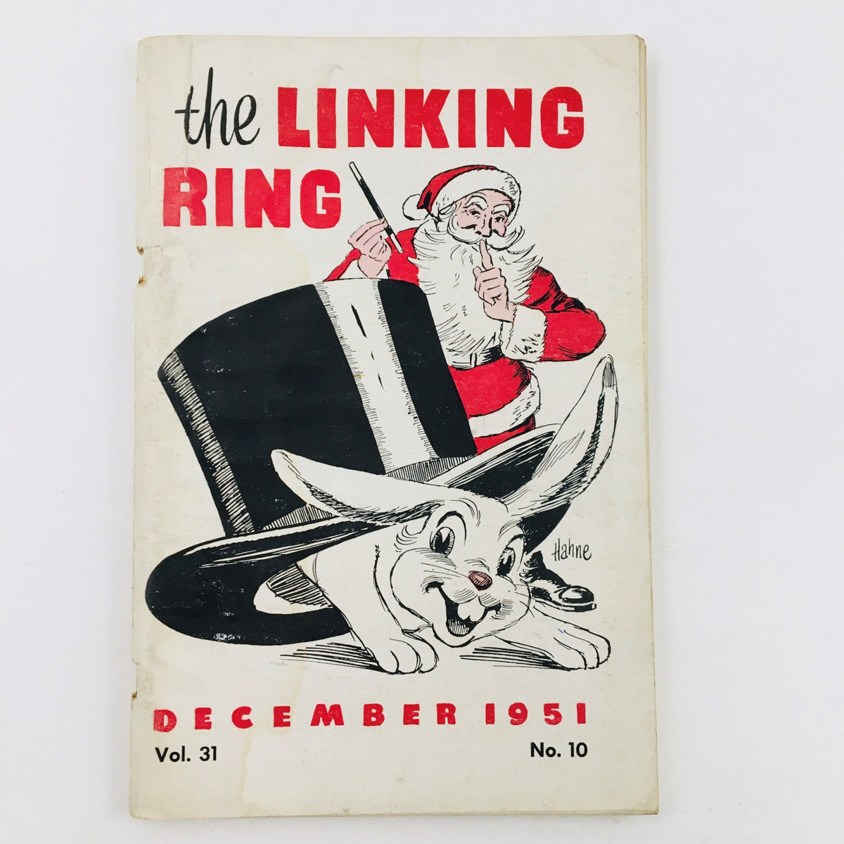 Cover of The Linking Ring Vol. 31 No. 10 December 1951 featuring Santa Claus and a rabbit emerging from a magician's hat.