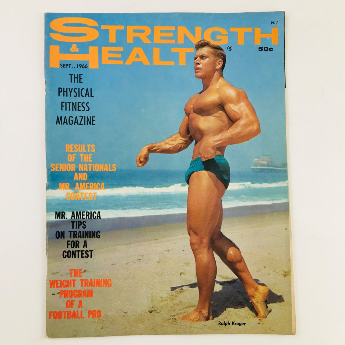 Cover of Strength & Health Magazine September 1966 featuring bodybuilder Ralph Kroger on the beach, showcasing fitness trends of the 1960s.