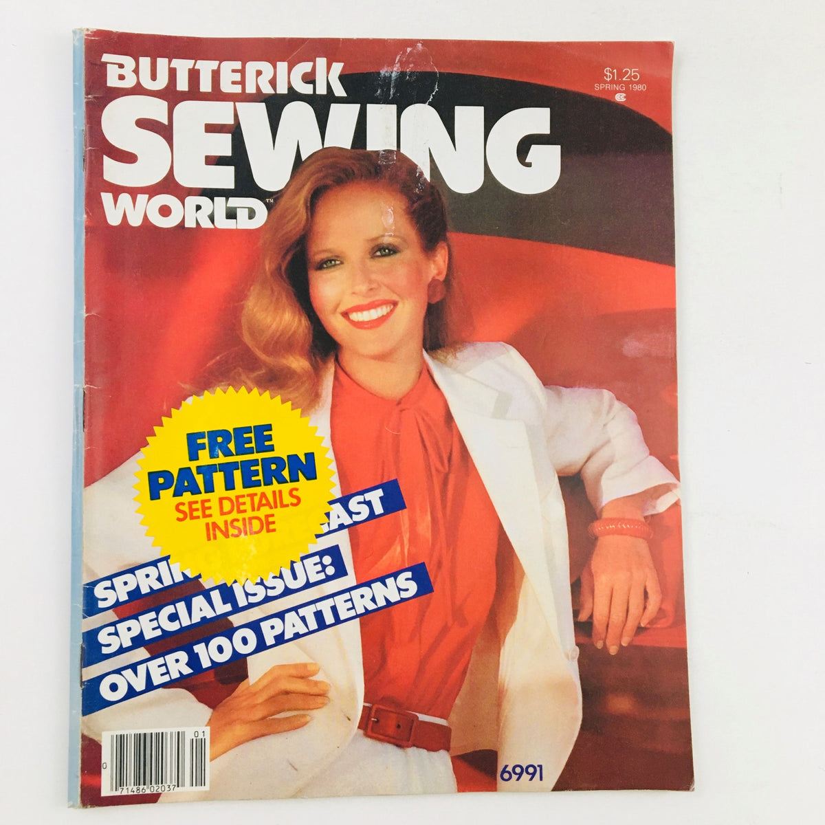 Cover of Butterick Sewing World Magazine Spring 1980 featuring a model with long hair, wearing a red blouse and white blazer, promoting the issue with a focus on silk blends and a free pattern offer.