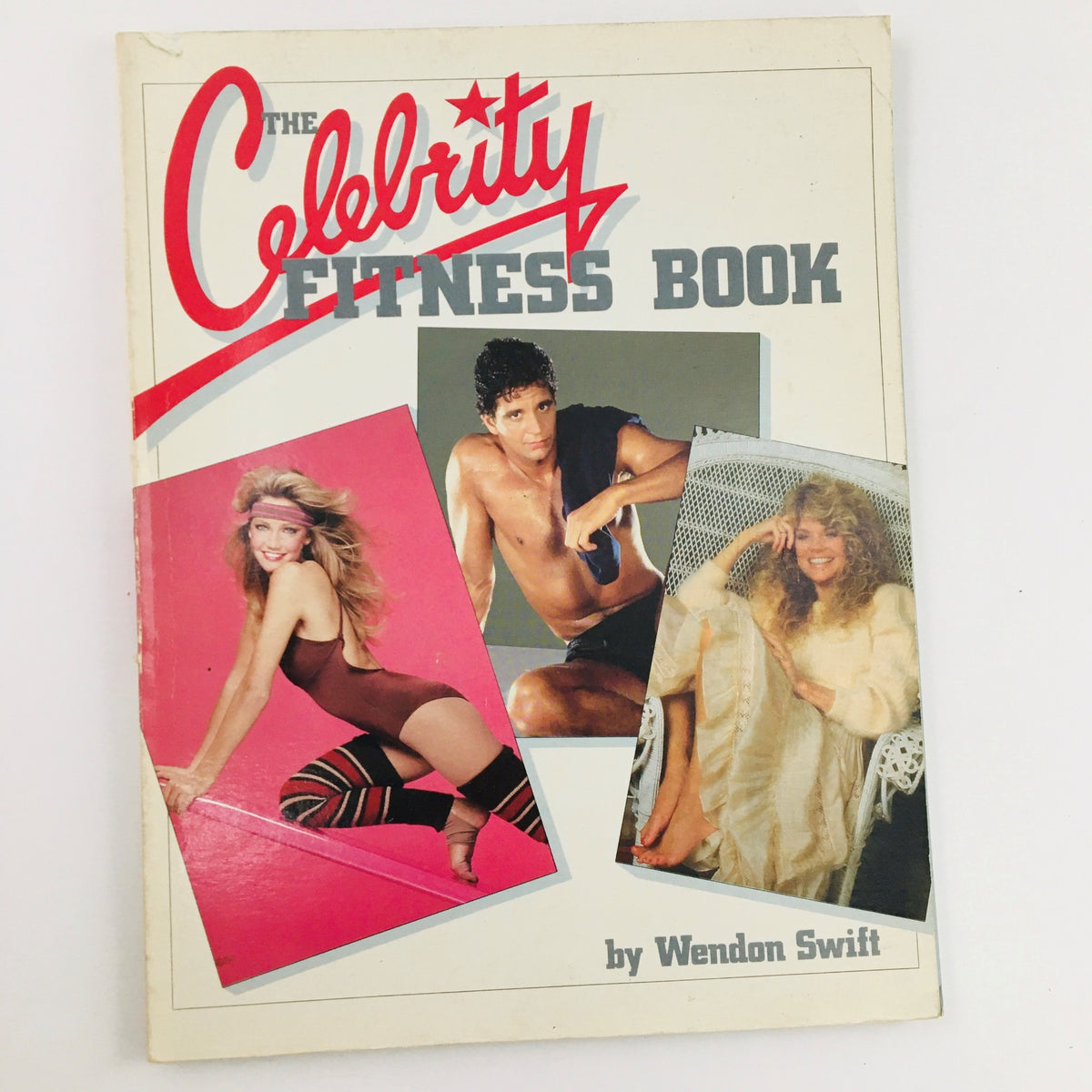 Cover of 'The Celebrity Fitness Book' by Wendon Swift featuring fitness models showcasing vintage workout attire and styles from the early 1980s.