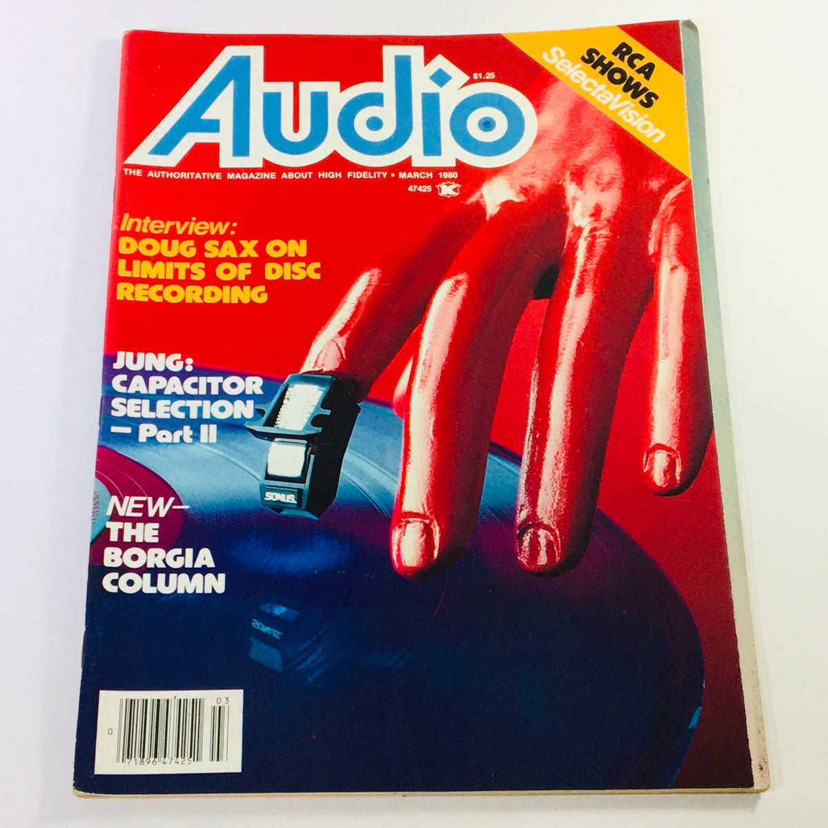 Cover of the Vintage Audio Magazine, March 1980, featuring the title 'Audio' prominently. The cover includes an interview with Doug Sax on disc recording and highlights the Borgia Column. Visuals include a bold red background with a hand interacting with a vinyl record, making it a collector's item for audio enthusiasts.