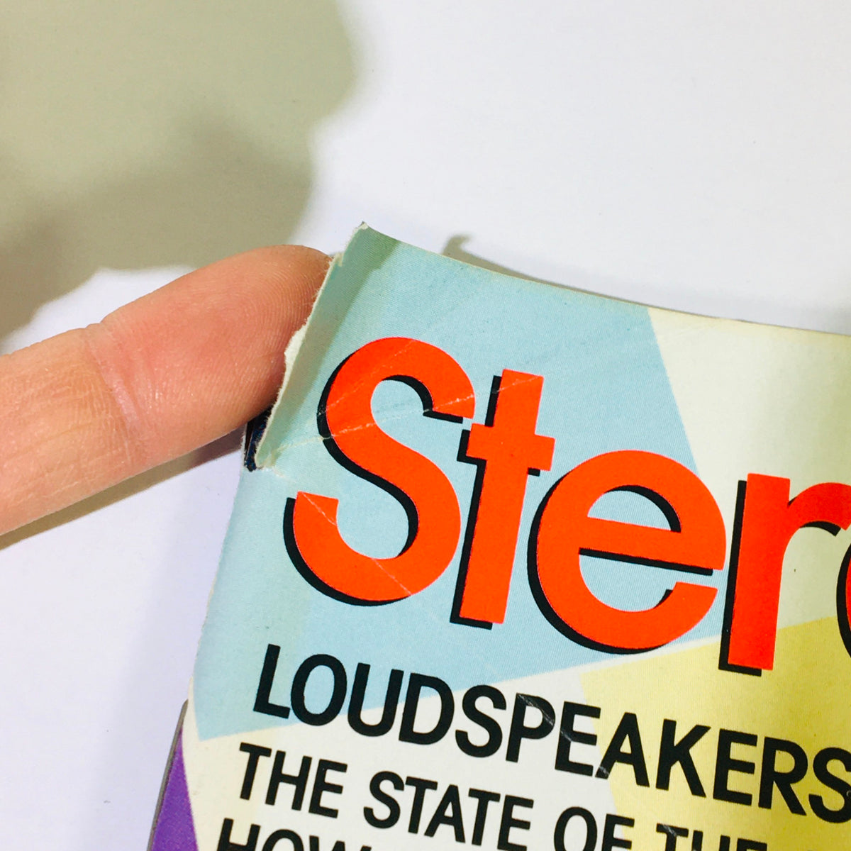 Close-up of the corner of the VTG Stereo Review Magazine, September 1987 issue, highlighting the magazine's title with text about loudspeakers and purchasing guides.