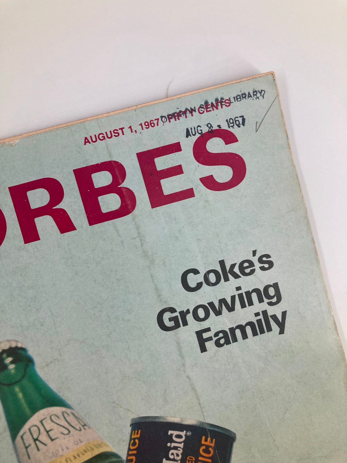 Close-up of the Forbes Magazine cover from August 1, 1967, highlighting the title 'Coke's Growing Family' and vintage design elements.