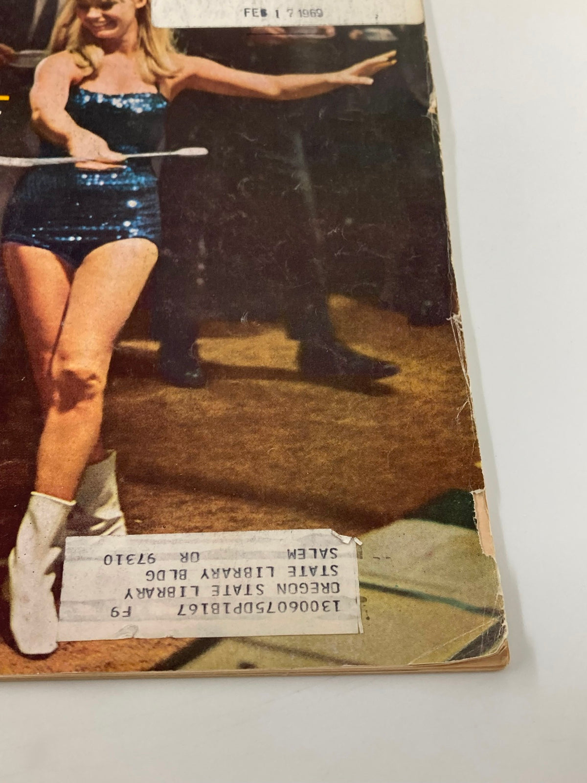 Close-up of the vintage Forbes Magazine cover dated February 15, 1969, showcasing 'Multi-Billion-Dollar American Ritual' with a focus on a performer holding a prop.