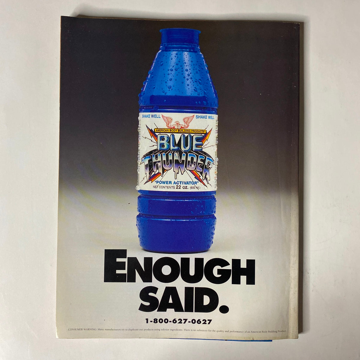 Cover of Blue Thunder advertisement from IronMan Magazine September 1994 issue, featuring a blue sports drink bottle with the tagline 'Enough Said'. IronMan Magazine September 1994 Vol 53 No. 9 featuring Aaron Baker with poster included.
