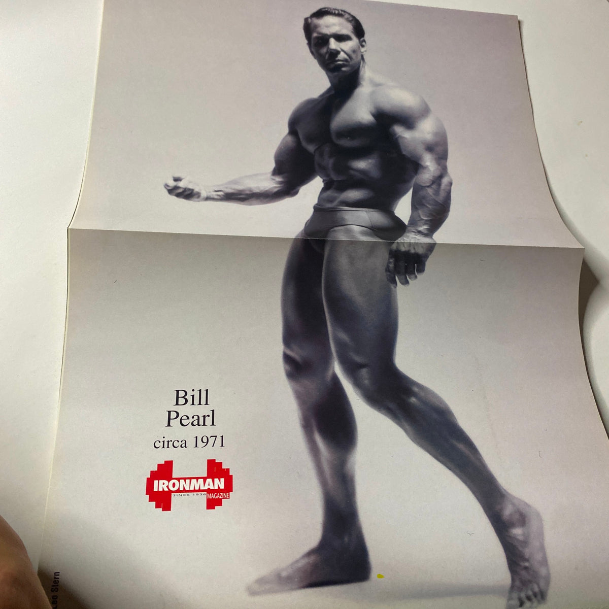 Poster of Bill Pearl from IronMan Magazine October 1994 Vol 53 No 10, depicting the legendary bodybuilder in a classic pose, representing the history of bodybuilding.