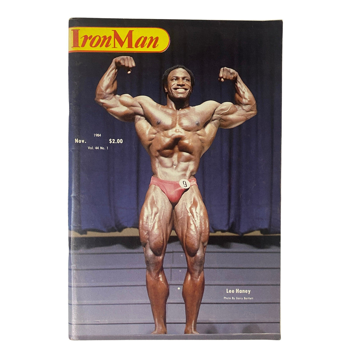 IronMan Magazine November 1984 Vol 44 No. 1 featuring Lee Haney on the cover, showcasing the newly crowned 1984 Mr. Olympia in a classic bodybuilding pose.