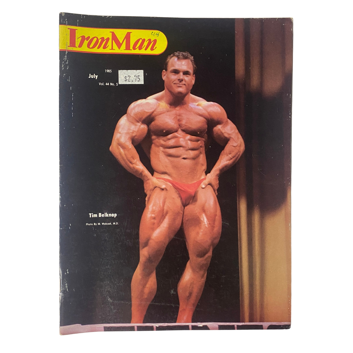 Cover of IronMan Magazine, July 1985, Volume 44, Number 5 featuring Tim Belknap, the notable bodybuilder, showcasing his impressive physique.