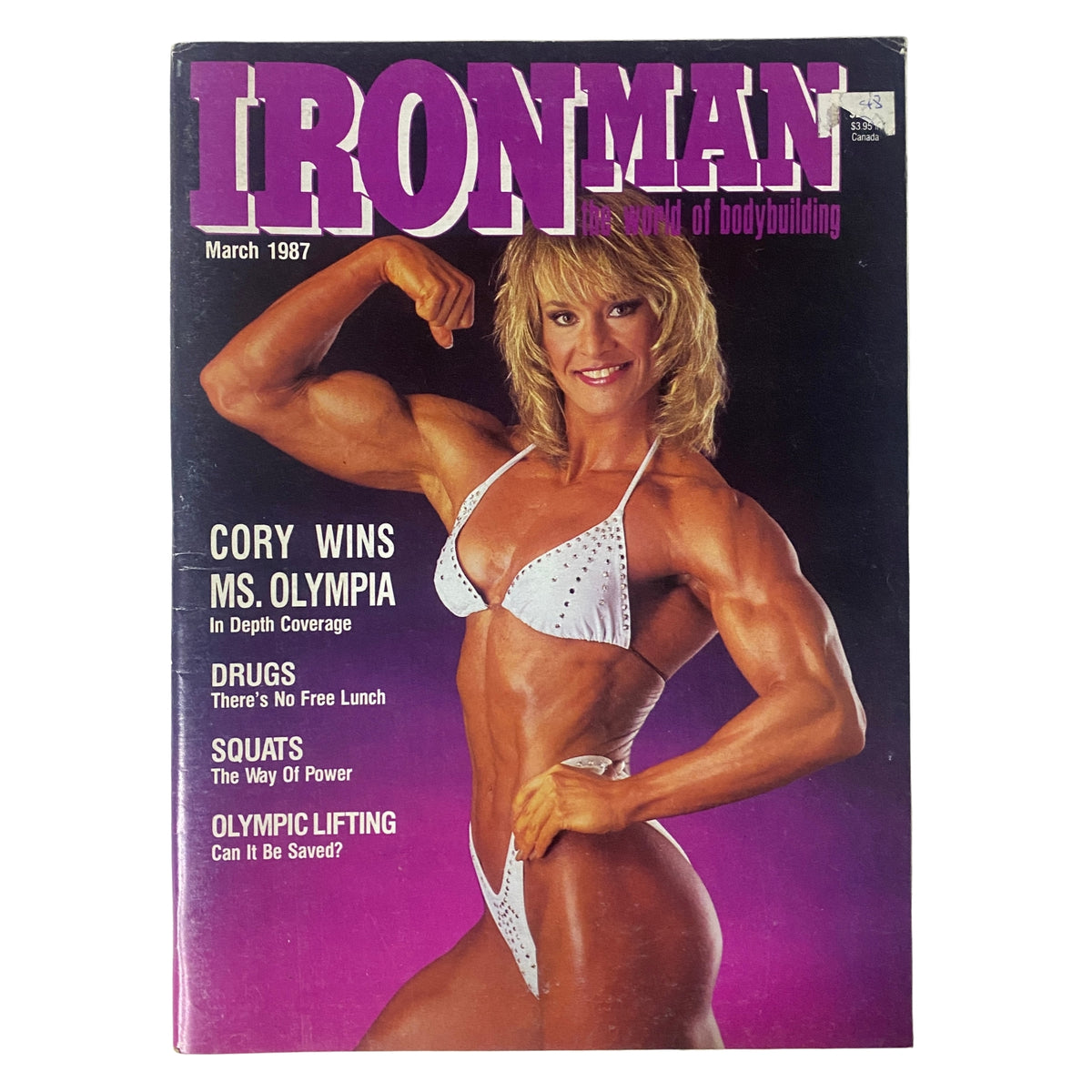 IronMan Magazine March 1987 Cover featuring Cory Everson celebrating her Ms. Olympia win, showcasing her strong physique in a white bikini and vibrant graphics.