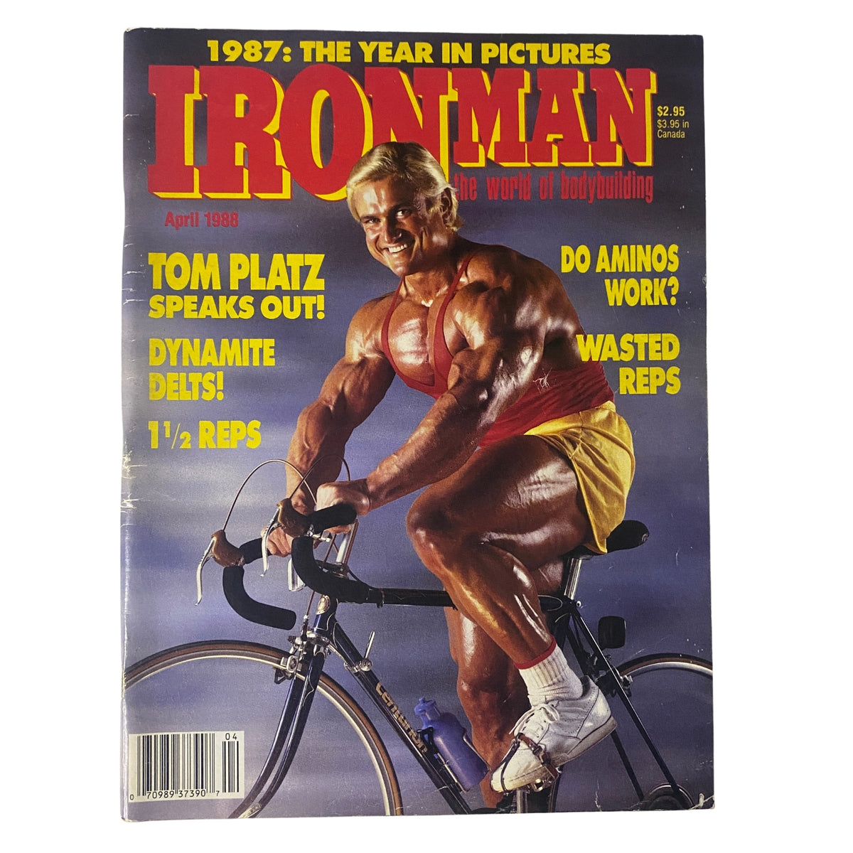 Cover of IronMan Magazine, April 1988, featuring Tom Platz on a bicycle, highlighting the theme 'The Year in Pictures'. This issue showcases bodybuilding topics and insights.