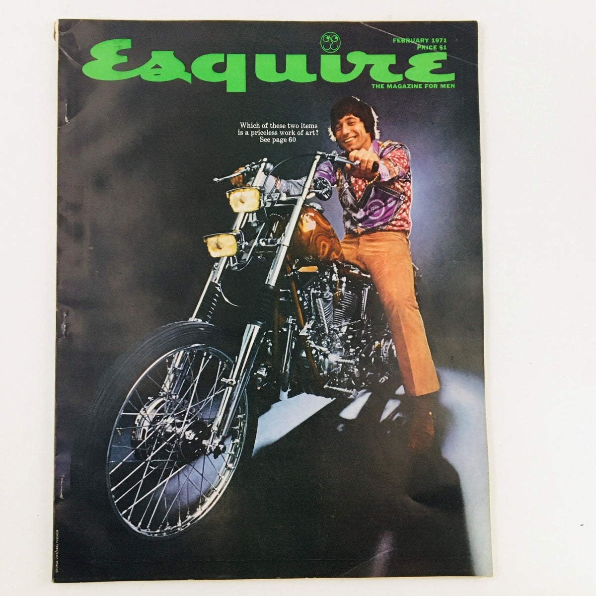 Cover of VTG Esquire Magazine February 1971 featuring a man on a motorcycle, showcasing vibrant fashion and cultural elements of the early 1970s. The title reads 'Sissy Bars Will Be Lower This Year'.