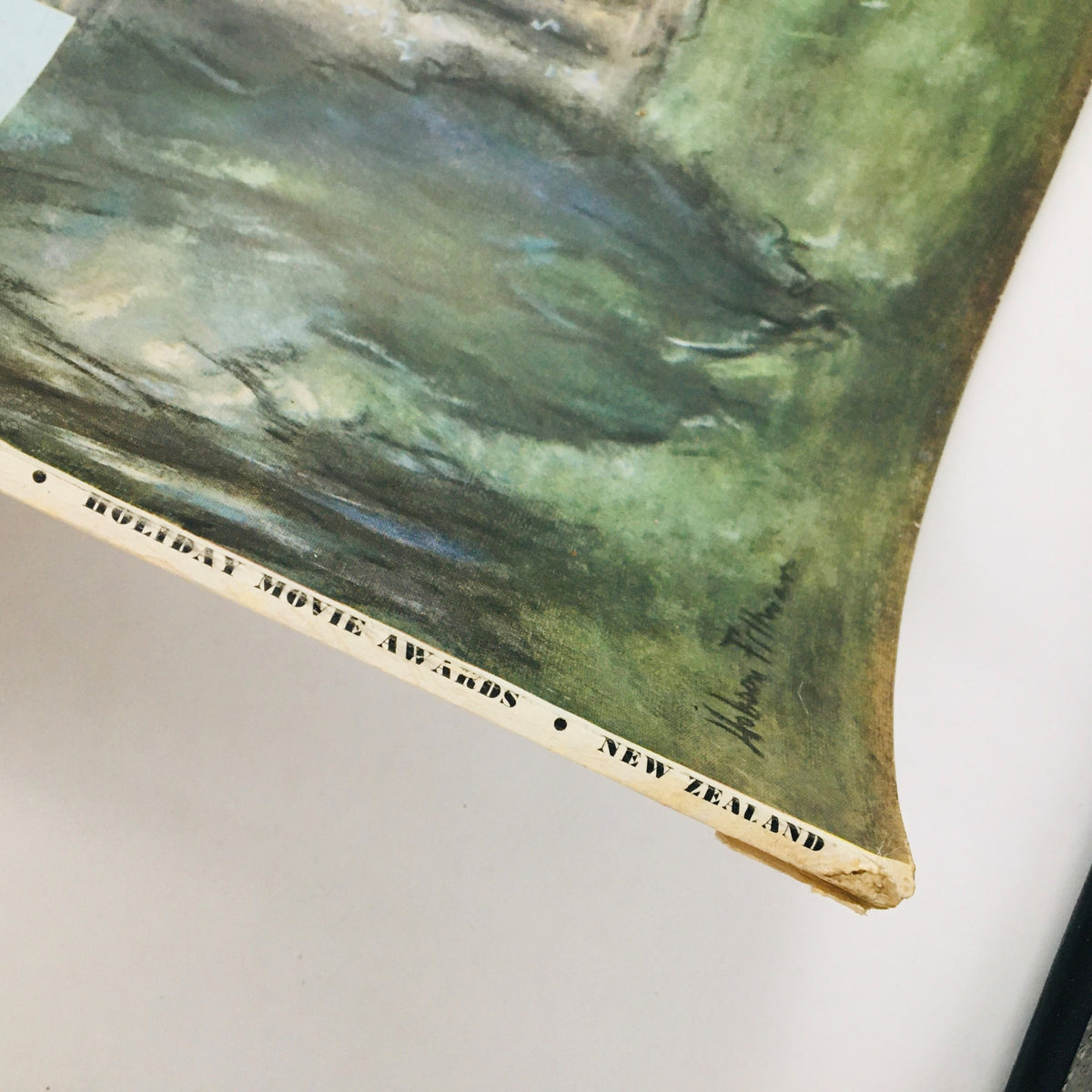 Close-up of the corner of the VTG Holiday Magazine from January 1951, showcasing the signature of the artist Hobson Pittman.