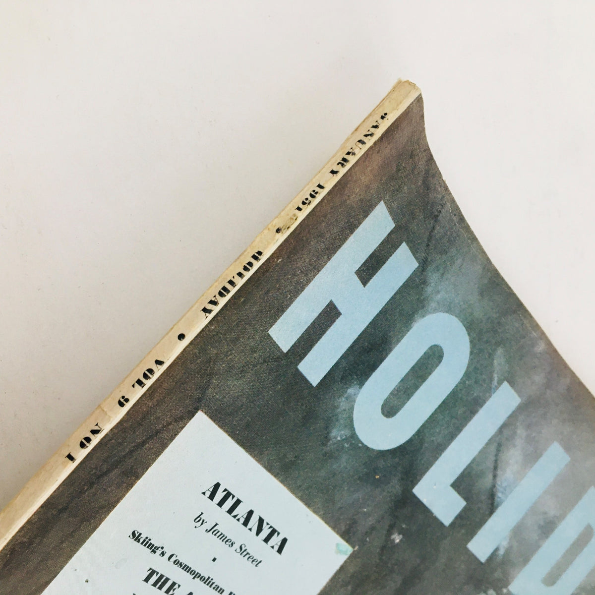 Side view of the spine of VTG Holiday Magazine from January 1951 with title and publication details.