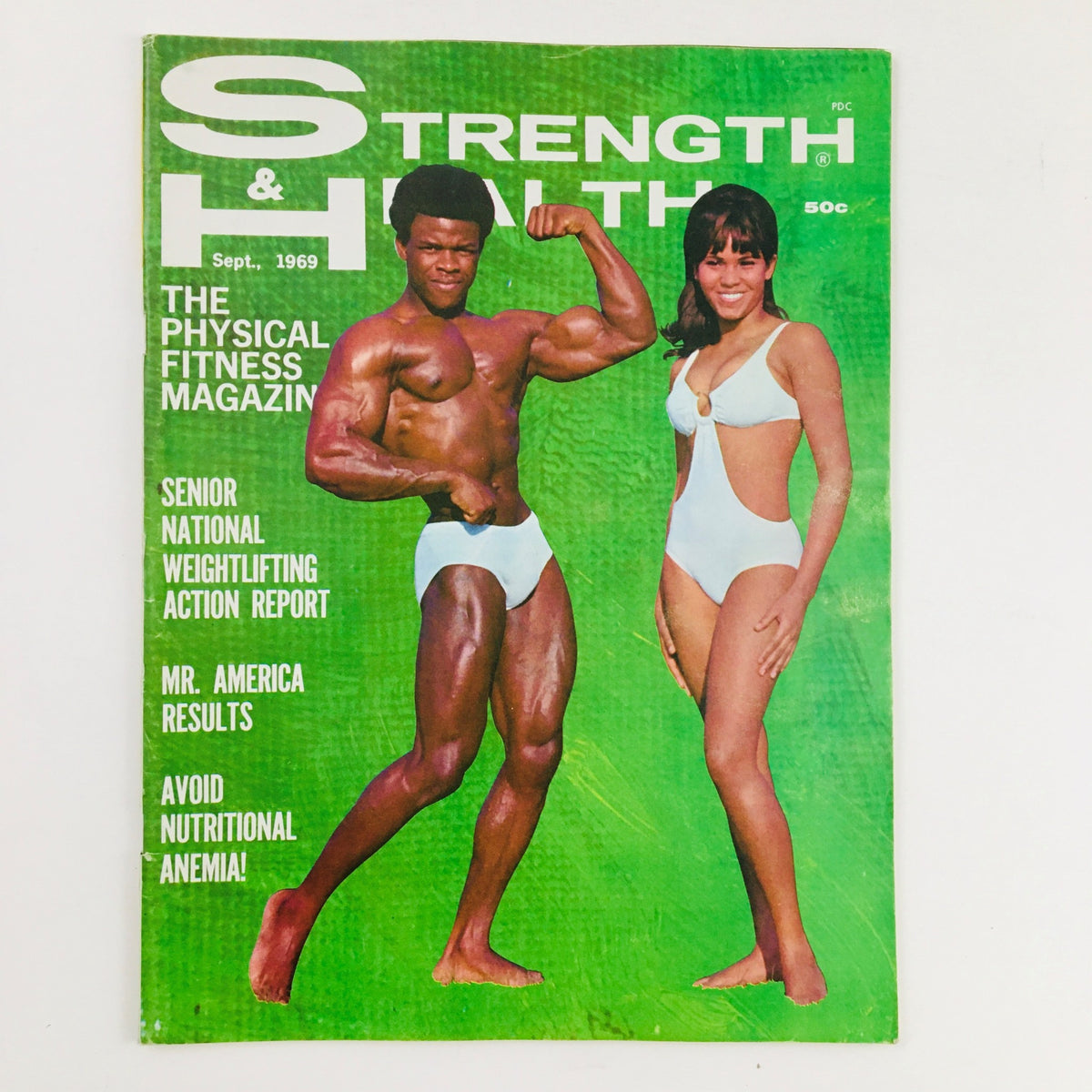 Cover of Strength & Health Magazine September 1969 featuring Ken Covington and Olivia Barbour showcasing physical fitness. The magazine highlights fitness culture of the late 60s.