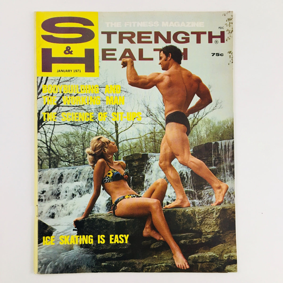 Cover of Strength & Health Magazine January 1971 featuring fitness models Tom Seward and Mayda Phillips with a scenic waterfall background.