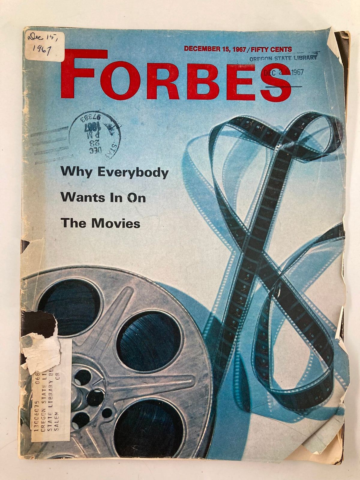 Cover of VTG Forbes Magazine from December 15, 1967, featuring the title 'Why Everybody Wants In On The Movies' along with a film reel illustration and library stamp.