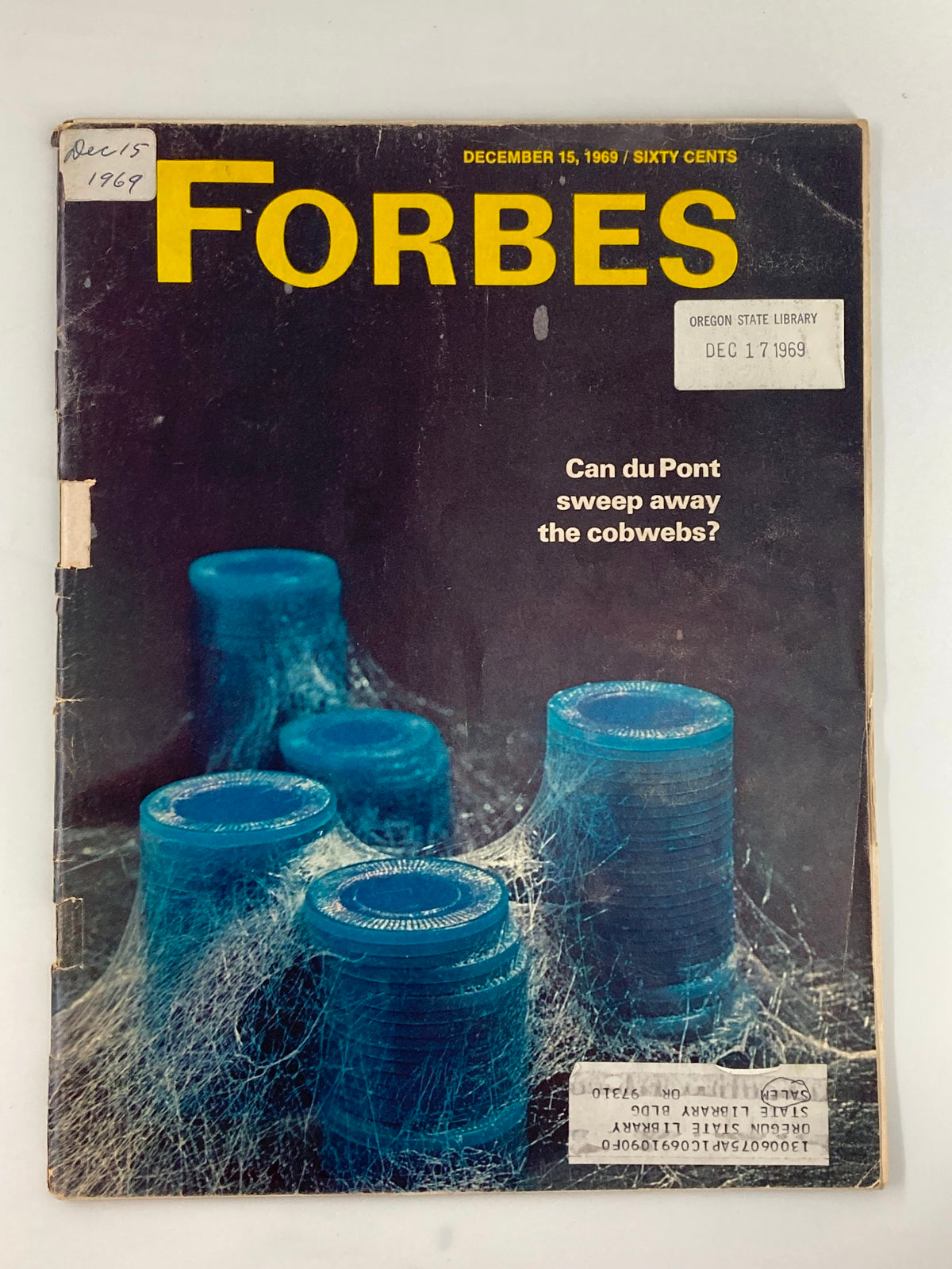 Vintage Forbes Magazine cover from December 15, 1969, featuring the title 'Can du Pont Sweep Away the Cobwebs?' and showcasing unique blue canisters with cobwebs, perfect for collectors and history enthusiasts.